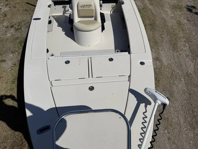Slide: The Image of 2009 Hewes 18 Redfisher boat, white deck, seating, and trolling motor, viewed from above. - 16