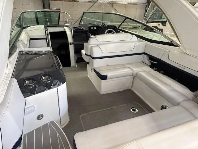 Slide: The Image of 2020 Formula 350 Sun Sport boat interior with white seating and sleek design. - 10