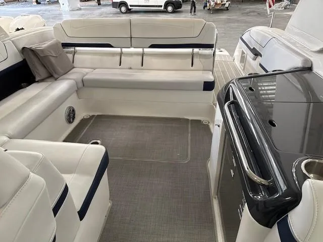 Slide: The Image of 2020 Formula 350 Sun Sport boat interior with white seating and sleek design. - 11