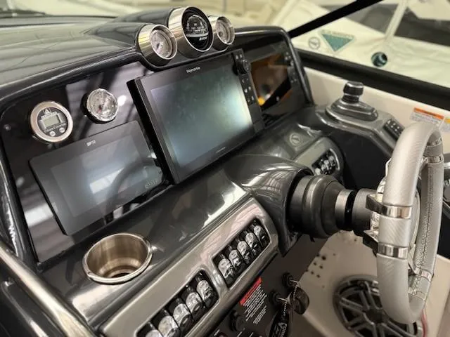 Slide: The Image of Control panel of a 2020 Formula 350 Sun Sport boat with modern navigation displays. - 14