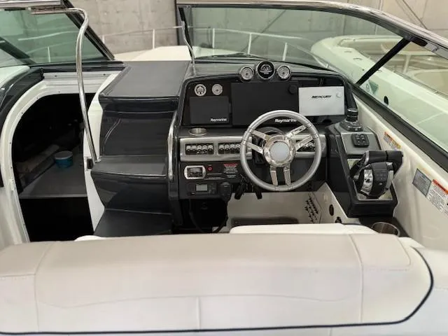 Slide: The Image of 2020 Formula 350 Sun Sport boat cockpit with modern steering and control panel. - 17
