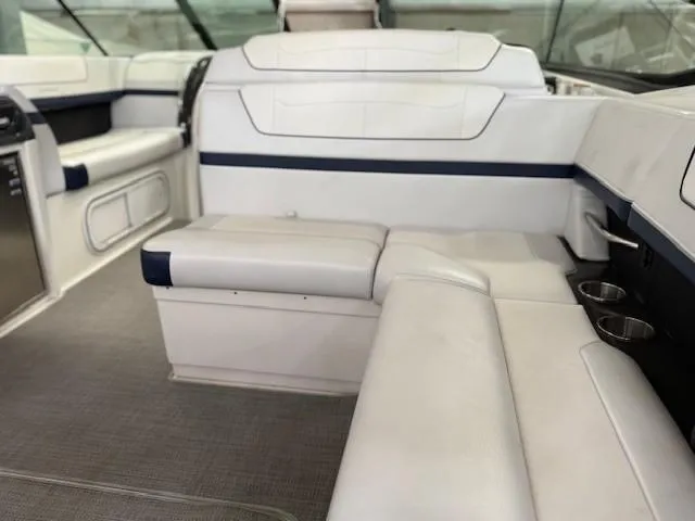 Slide: The Image of 2020 Formula 350 Sun Sport boat interior with white leather seating and cup holders. - 19