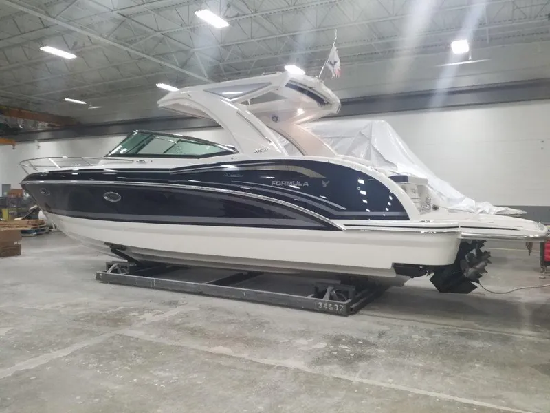 Slide: The Image of 2020 Formula 350 Sun Sport boat in a warehouse setting. - 2