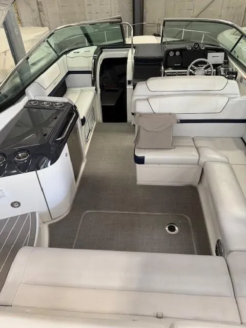 Slide: The Image of 2020 Formula 350 Sun Sport boat interior with white seating and modern dashboard. - 21