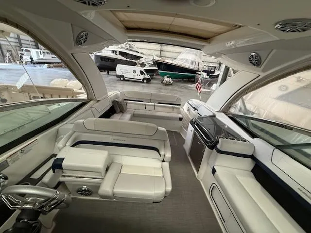 Slide: The Image of Interior of a 2020 Formula 350 Sun Sport boat in a marina setting. - 27