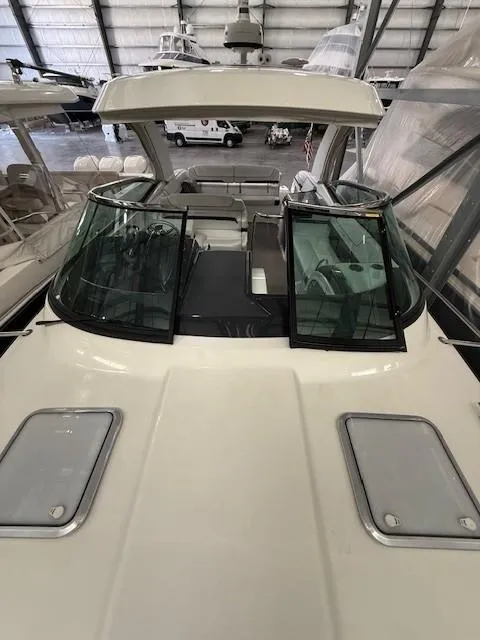 Slide: The Image of 2020 Formula 350 Sun Sport boat in a storage facility, showcasing sleek design and windshield. - 28