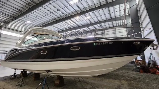 Slide: The Image of 2020 Formula 350 Sun Sport boat in a spacious indoor storage facility. - 3
