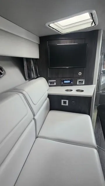 Slide: The Image of 2020 Formula 350 Sun Sport interior with sleek seating, entertainment system, and modern design. - 31