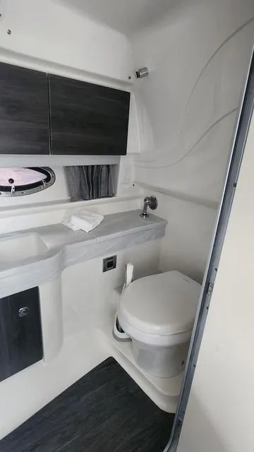 Slide: The Image of 2020 Formula 350 Sun Sport boat bathroom with modern fixtures and compact design. - 32