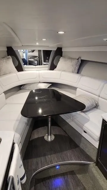 Slide: The Image of 2020 Formula 350 Sun Sport cabin with sleek seating and modern table design. - 36