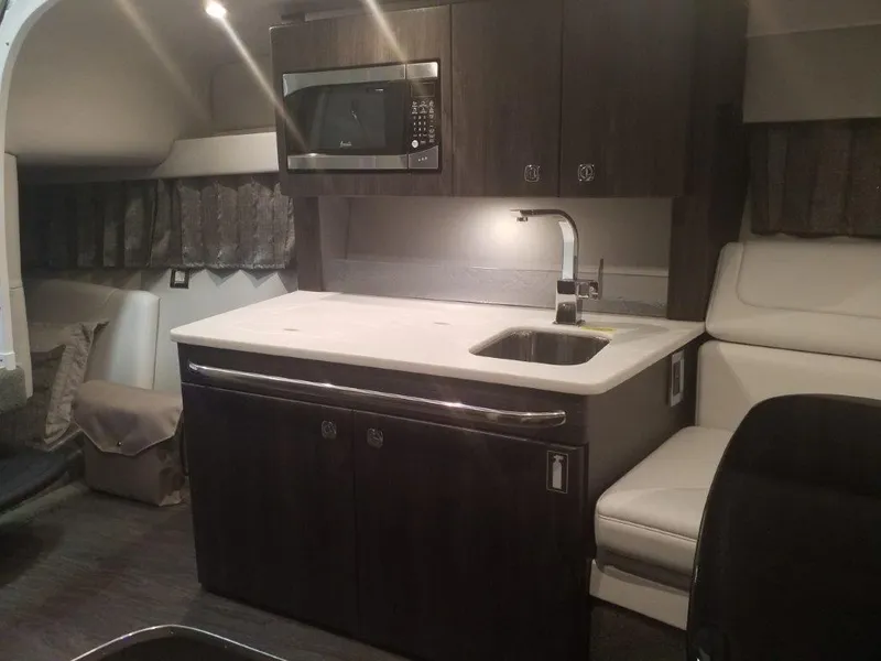 Slide: The Image of Interior of 2020 Formula 350 Sun Sport boat with kitchenette and seating area. - 39