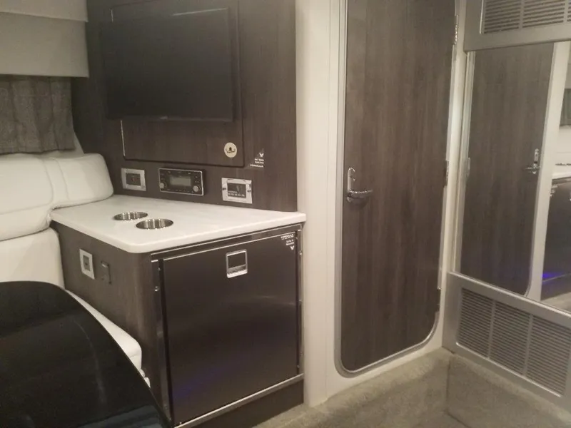 Slide: The Image of 2020 Formula 350 Sun Sport interior with kitchenette, TV, and modern cabinetry. - 40