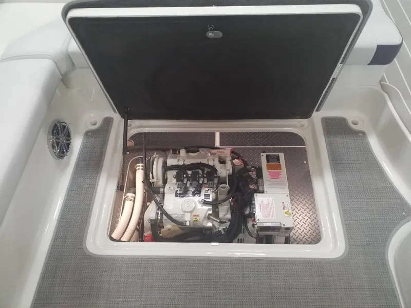 Slide: The Image of Engine compartment of a 2020 Formula 350 Sun Sport boat, showcasing mechanical components. - 42