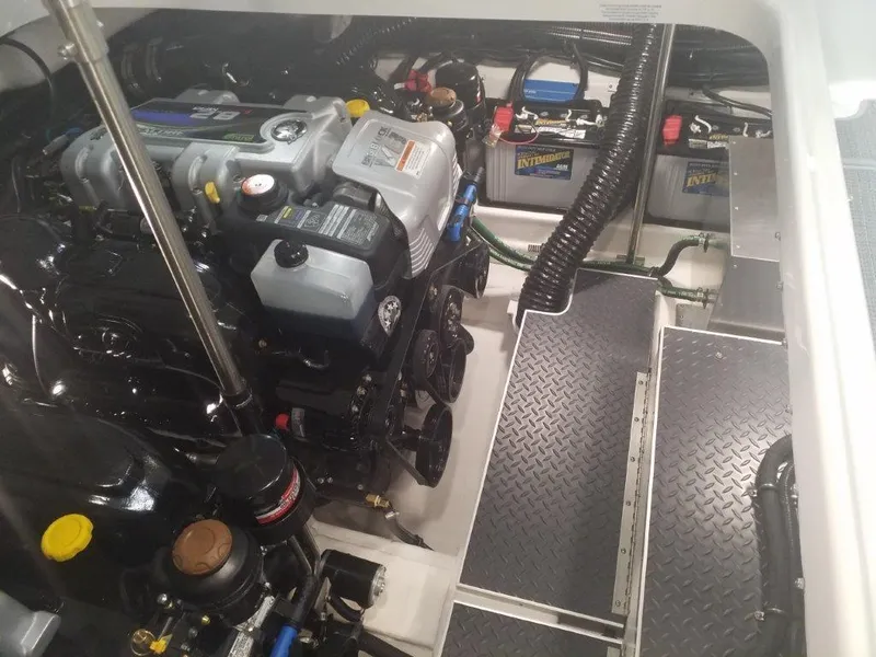 Slide: The Image of Engine compartment of a 2020 Formula 350 Sun Sport boat, showcasing mechanical components. - 44
