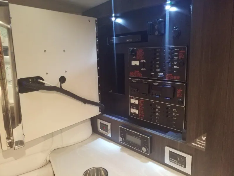 Slide: The Image of Control panel inside 2020 Formula 350 Sun Sport boat, featuring illuminated switches and controls. - 45