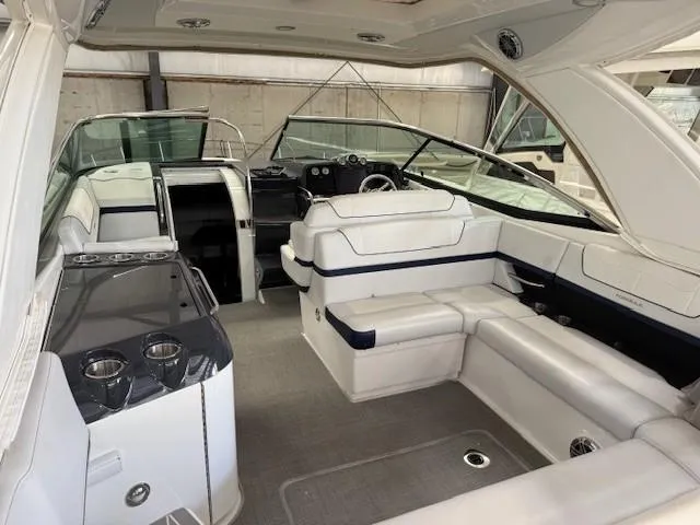 Slide: The Image of 2020 Formula 350 Sun Sport boat interior with white seating and sleek design. - 8
