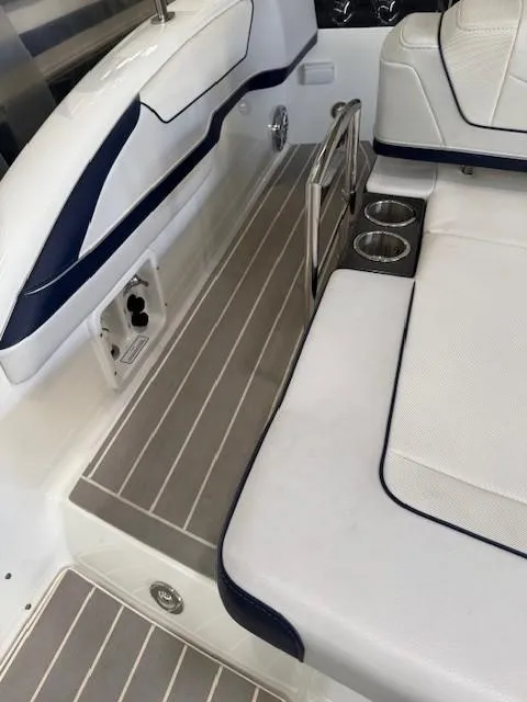 Slide: The Image of 2020 Formula 350 Sun Sport boat interior with seating and cup holders. - 9