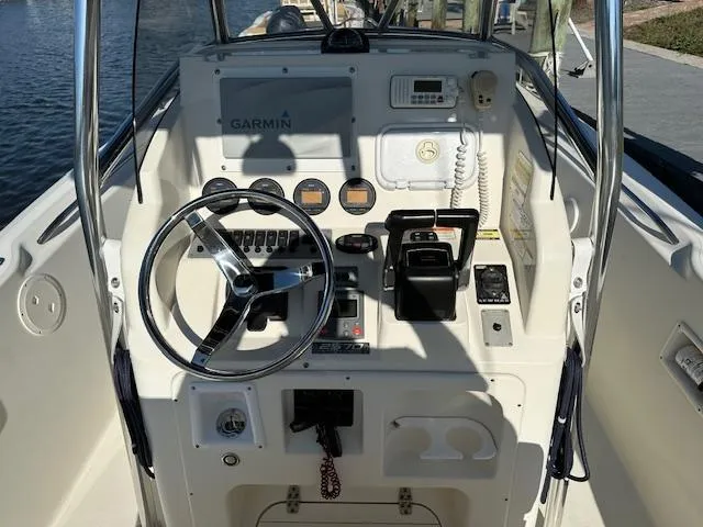 Slide: The Image of 2005 Pursuit 2570 Center Console boat dashboard with Garmin navigation system. - 4