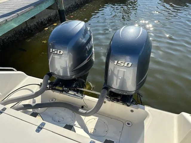 Slide: The Image of Twin Yamaha 150 outboard motors on a 2005 Pursuit 2570 Center Console boat. - 6