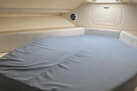 Slide: The Image of 1998 Carver 380 Santego cabin interior with a spacious bed and soft lighting. - 15