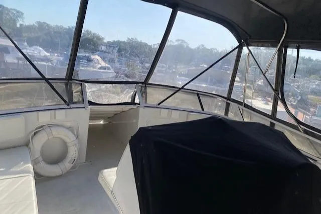 Slide: The Image of 1998 Carver 380 Santego boat interior with seating and life preserver. - 19