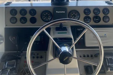 Slide: The Image of 1998 Carver 380 Santego helm with steering wheel and navigation instruments. - 21