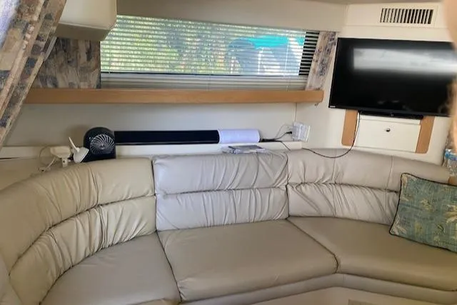 Slide: The Image of Interior of 1998 Carver 380 Santego yacht with leather seating and TV. - 9