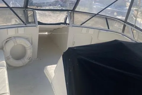 Slide: The Image of 1998 Carver 380 Santego boat interior with seating and life preserver. - 18