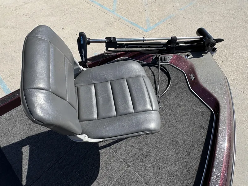 Slide: The Image of Champion MEAN 16 boat, 1999 model, featuring a gray seat and trolling motor. - 10