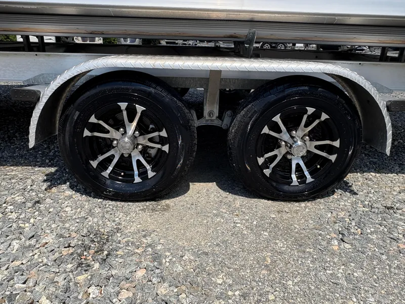 Slide: The Image of Trailer wheels of a 2020 G3 SunCatcher on gravel surface. - 10