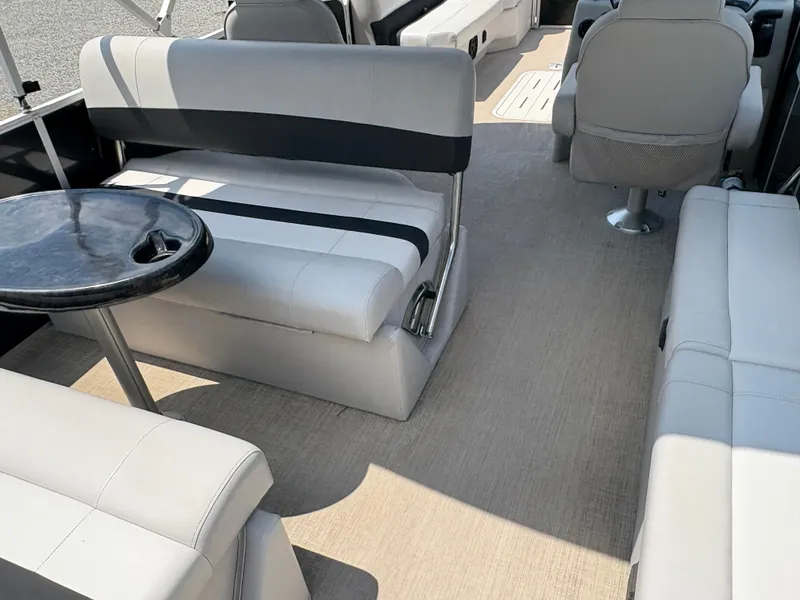 Slide: The Image of 2020 G3 SunCatcher interior with gray seating and a small round table. - 13