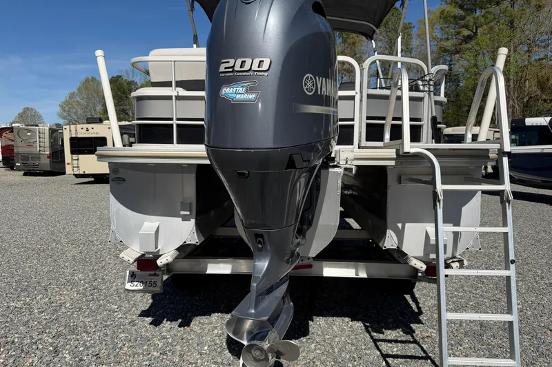 Slide: The Image of 2020 SunCatcher V324 SL pontoon boat with Yamaha 200 engine, parked outdoors. - 18