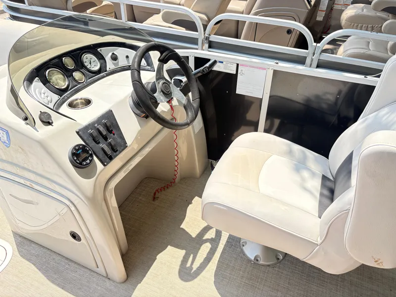 Slide: The Image of 2020 G3 SunCatcher boat cockpit with steering wheel and control panel. - 29
