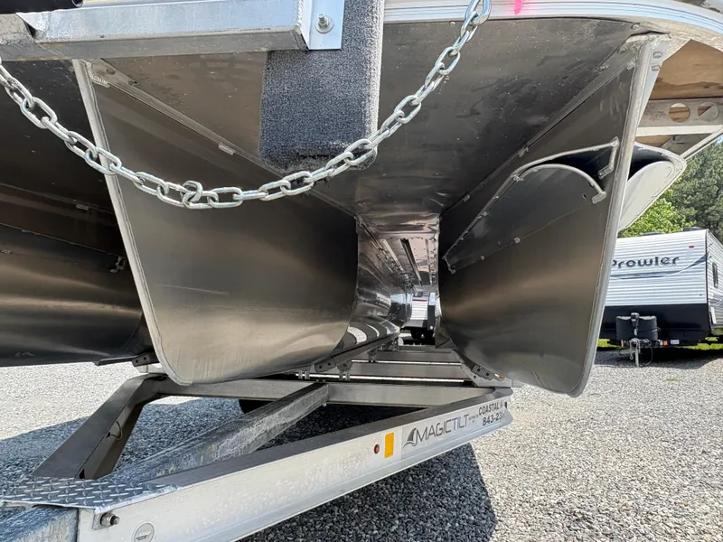 Slide: The Image of 2020 G3 SunCatcher pontoon boat underside on trailer, showcasing aluminum pontoons. - 6