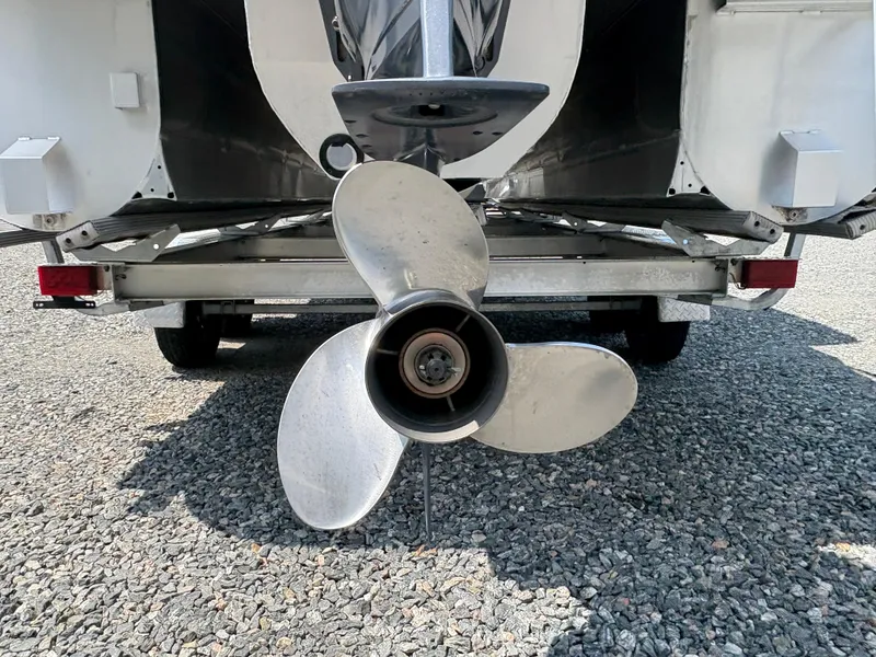 Slide: The Image of 2020 G3 SunCatcher boat propeller on gravel surface, rear view. - 9