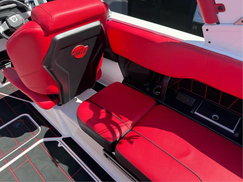 Slide: The Image of Red and black interior of 2023 Malibu Wakesetter 23 MXZ boat. - 12