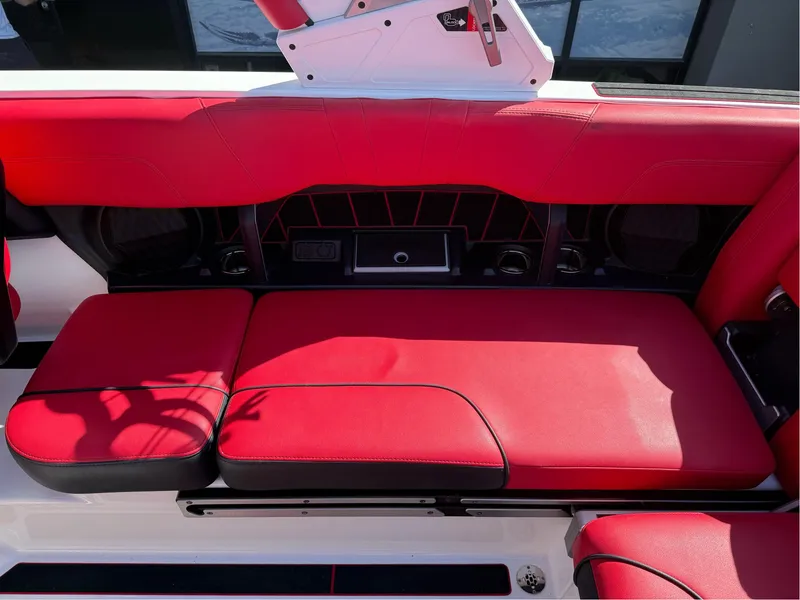Slide: The Image of 2023 Malibu Wakesetter 23 MXZ red seating area with sleek design and modern features. - 13