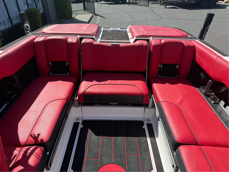 Slide: The Image of 2023 Malibu Wakesetter 23 MXZ interior with vibrant red seating and sleek design. - 15