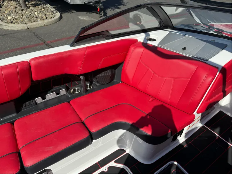 Slide: The Image of 2023 Malibu Wakesetter 23 MXZ interior with red and black seating. - 21