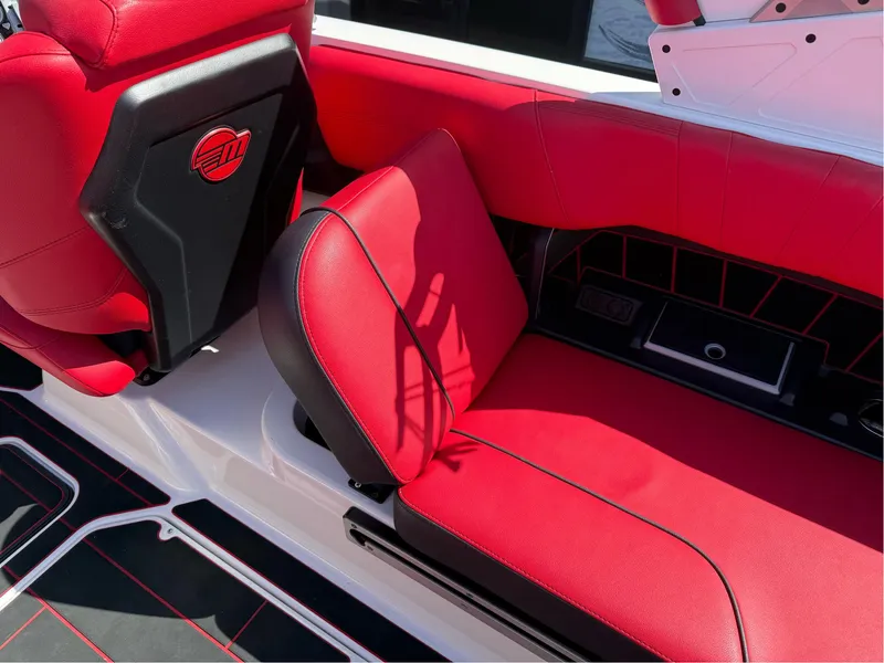 Slide: The Image of 2023 Malibu Wakesetter 23 MXZ interior with red and black seating. - 26