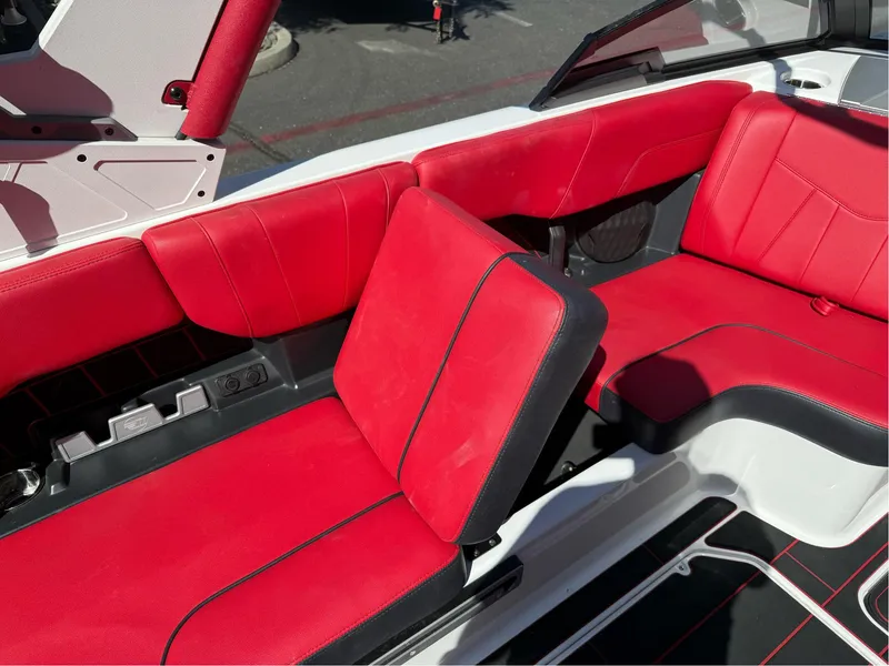 Slide: The Image of 2023 Malibu Wakesetter 23 MXZ interior with red and black seating. - 29
