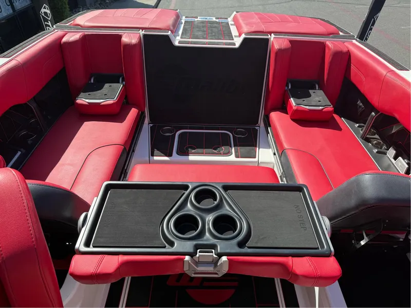 Slide: The Image of 2023 Malibu Wakesetter 23 MXZ interior with red seating and cup holders. - 30