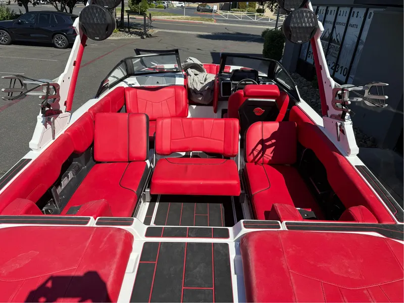 Slide: The Image of 2023 Malibu Wakesetter 23 MXZ with vibrant red interior and spacious seating. - 31
