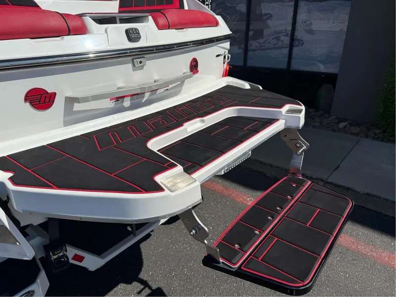 Slide: The Image of 2023 Malibu Wakesetter 23 MXZ swim platform with red and black accents. - 34