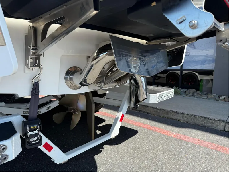 Slide: The Image of 2023 Malibu Wakesetter 23 MXZ boat propeller and exhaust detail. - 40