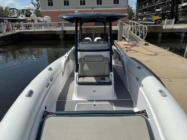 Slide: The Image of 2021 Airship 340 RIB boat docked, featuring spacious seating and modern design. - 13