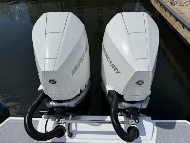 Slide: The Image of Twin Mercury outboard engines on a 2021 Airship 340 RIB boat. - 21
