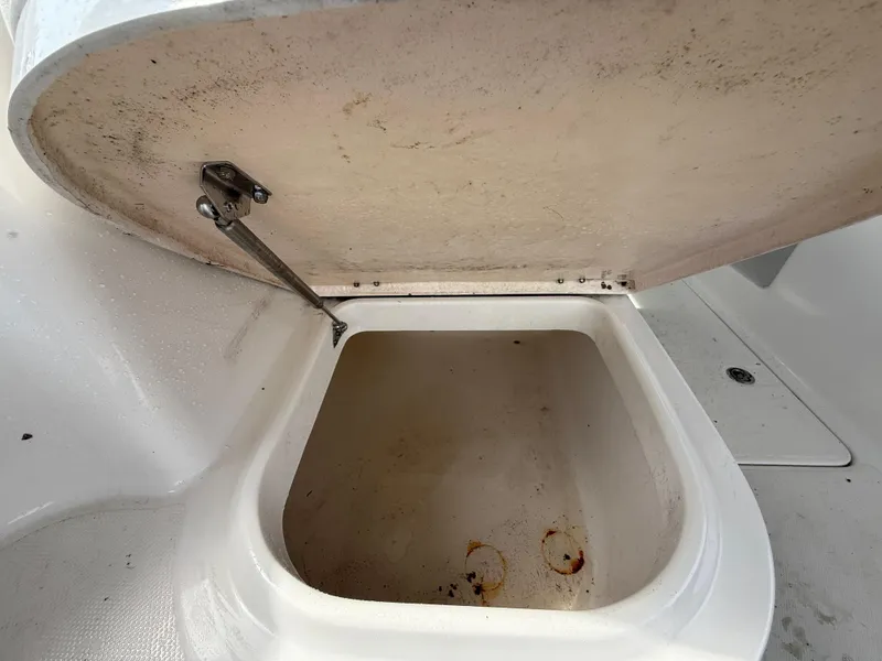 Slide: The Image of Open storage compartment on 2013 Robalo R245 Walkaround boat. - 17