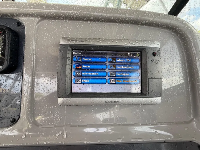 Slide: The Image of Garmin display on 2013 Robalo R245 Walkaround boat, showing navigation options. - 27