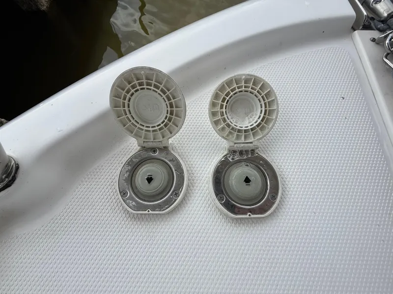 Slide: The Image of Open deck hatches on a 2013 Robalo R245 Walkaround boat. - 49